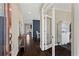 Inviting hallway with hardwood floors, leading to a dining room and office space at 305 Norwood Ne Ave, Atlanta, GA 30317