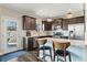 Modern kitchen features stainless steel appliances, counter seating, and a door leading outside at 305 Norwood Ne Ave, Atlanta, GA 30317