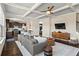 Bright living room showcasing modern furnishings, coffered ceilings and lots of natural light from many windows at 305 Norwood Ne Ave, Atlanta, GA 30317