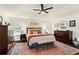 Bright primary bedroom with neutral walls, a ceiling fan, and lots of natural light at 305 Norwood Ne Ave, Atlanta, GA 30317