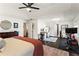 Primary bedroom with ensuite featuring workout equipment, office space and king bed at 305 Norwood Ne Ave, Atlanta, GA 30317