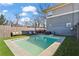 Backyard view of modern pool, outdoor seating, and privacy fence, perfect for entertaining or relaxation at 305 Norwood Ne Ave, Atlanta, GA 30317