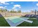 Modern pool featuring a sleek concrete surround, green turf, and comfortable lounge seating for relaxation at 305 Norwood Ne Ave, Atlanta, GA 30317