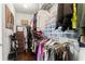 Walk-in closet features ample hanging and shelf space providing organization for clothing, shoes, and accessories at 305 Norwood Ne Ave, Atlanta, GA 30317