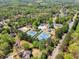 Community amenities including tennis courts and a pool surrounded by lush trees and well-maintained landscaping at 6165 Lake Oak Lndg, Cumming, GA 30040