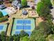 Aerial view of tennis courts and recreational facilities enhancing the community's appeal at 6165 Lake Oak Lndg, Cumming, GA 30040