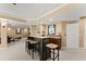 Basement area featuring a wet bar with barstools, creating a perfect space for entertaining guests at 6165 Lake Oak Lndg, Cumming, GA 30040