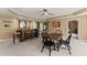 Basement rec room features bar seating, drop ceiling, and adjacent bedroom at 6165 Lake Oak Lndg, Cumming, GA 30040