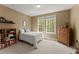 Cozy bedroom with carpet floors and natural light from a double window at 6165 Lake Oak Lndg, Cumming, GA 30040