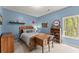 Bright bedroom with natural light, wooden furniture, and a cozy atmosphere at 6165 Lake Oak Lndg, Cumming, GA 30040