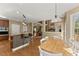 Open kitchen features stainless appliances, granite countertops and bar seating at 6165 Lake Oak Lndg, Cumming, GA 30040