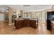 Spacious kitchen boasts wood floors, breakfast nook and access to outdoor area at 6165 Lake Oak Lndg, Cumming, GA 30040