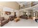 Expansive living room with open layout, soaring ceilings, and seamless transition to the kitchen and dining areas at 6165 Lake Oak Lndg, Cumming, GA 30040