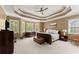 Serene bedroom with tray ceilings, natural light, and a calming color palette at 6165 Lake Oak Lndg, Cumming, GA 30040