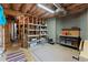 Unfinished basement with exposed ductwork and shelving for storage at 6165 Lake Oak Lndg, Cumming, GA 30040