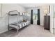Bedroom with a sturdy bunk bed, carpet flooring, natural light, and a dresser at 11841 Rizvan Pl, Covington, GA 30014