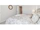 Bedroom with neutral décor and plush bedding, offering a calm and inviting retreat at 11841 Rizvan Pl, Covington, GA 30014