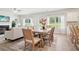 Well-lit dining room featuring backyard views and an open layout with the living area at 11841 Rizvan Pl, Covington, GA 30014
