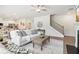 Spacious open-concept design connecting the living room, dining area, and staircase at 11841 Rizvan Pl, Covington, GA 30014