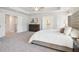 Bright main bedroom with tray ceiling and ensuite bathroom at 11841 Rizvan Pl, Covington, GA 30014