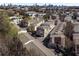 An aerial view of townhomes in a community near a cityscape on a sunny day at 1342 Rietveld Nw Row, Atlanta, GA 30318