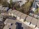 An aerial view of a townhouse community showing the roof lines on a sunny day at 1342 Rietveld Nw Row, Atlanta, GA 30318