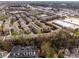 Aerial view of townhomes showcasing the community's layout, surrounding greenery, and architecture at 1342 Rietveld Nw Row, Atlanta, GA 30318