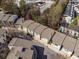 Aerial view of townhomes showcasing the community's layout, green spaces, and residential architecture at 1342 Rietveld Nw Row, Atlanta, GA 30318