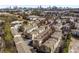 Aerial view of colorful townhome community showcasing the architecture and urban layout with Atlanta skyline at 1342 Rietveld Nw Row, Atlanta, GA 30318