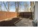Backyard features a patio, wooden fence, and mulched garden beds ready for landscaping at 1342 Rietveld Nw Row, Atlanta, GA 30318