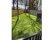 Backyard area featuring well maintained artificial turf and wooden fence at 1342 Rietveld Nw Row, Atlanta, GA 30318