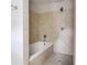 Close up of the bathtub and shower with decorative diagonal tile and nickel fixture at 1342 Rietveld Nw Row, Atlanta, GA 30318