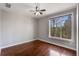 Bedroom with hardwood floors and large window overlooking lush scenery at 1342 Rietveld Nw Row, Atlanta, GA 30318