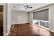 Bedroom featuring hardwood floors, large window, and modern lighting at 1342 Rietveld Nw Row, Atlanta, GA 30318
