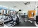 Resident fitness center with modern equipment and large windows overlooking the pool at 1342 Rietveld Nw Row, Atlanta, GA 30318