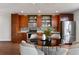 Well-equipped kitchen with wood cabinets, stainless steel appliances, tiled backsplash, and a sleek dining area at 1342 Rietveld Nw Row, Atlanta, GA 30318
