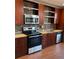 Modern kitchen featuring stainless steel appliances, tile backsplash, and granite countertops at 1342 Rietveld Nw Row, Atlanta, GA 30318