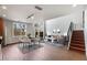 Spacious living room featuring high ceilings, lots of natural light, and modern staircase with metal railings at 1342 Rietveld Nw Row, Atlanta, GA 30318