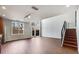 Bright living room with hardwood floors, large windows, and modern staircase at 1342 Rietveld Nw Row, Atlanta, GA 30318