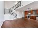 Spacious living area featuring hardwood floors, modern finishes, and an open staircase at 1342 Rietveld Nw Row, Atlanta, GA 30318