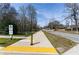View of the PATH Silver Comet Connector paved path with road to the side, trees, and green space at 1342 Rietveld Nw Row, Atlanta, GA 30318