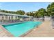 Outdoor pool with crystal-clear water, surrounded by lounge chairs and lush greenery at 1342 Rietveld Nw Row, Atlanta, GA 30318
