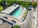 Aerial view of a sparkling community pool, lounge chairs, manicured greenery, and surrounding residences at 1342 Rietveld Nw Row, Atlanta, GA 30318