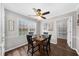 Cozy dining area with natural light, a ceiling fan, and an adjacent closet at 245 Hollyberry Ct, Roswell, GA 30076