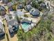 Aerial view of a home with a swimming pool and well-manicured grounds at 3405 Camellia Ln, Suwanee, GA 30024