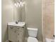 Neutral bathroom featuring a vanity with drawers, toilet, and shower head at 3405 Camellia Ln, Suwanee, GA 30024