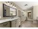 Bright bathroom with double vanities, large mirrors, and a soaking tub, creating a functional and luxurious space at 3405 Camellia Ln, Suwanee, GA 30024