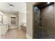 Bathroom showcasing a tiled shower, soaking tub, and vanity with sink, offering a blend of style and functionality at 3405 Camellia Ln, Suwanee, GA 30024