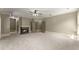 Large bedroom featuring a cozy fireplace, plush carpet, and multiple windows for plenty of natural light at 3405 Camellia Ln, Suwanee, GA 30024