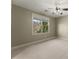 Spacious bedroom with neutral walls, carpet, ceiling fan, and plenty of natural light at 3405 Camellia Ln, Suwanee, GA 30024